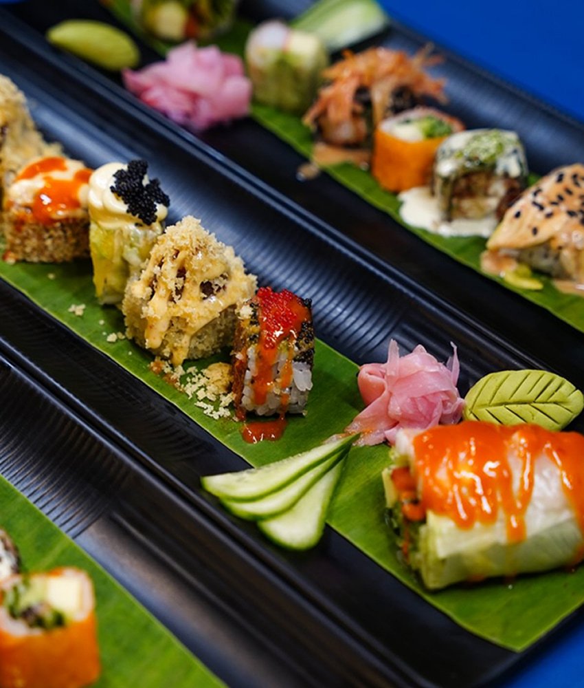 Assorted sushi platter with colorful rolls, pickled ginger, and garnishes served at Danial Star Restaurant